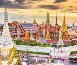 Bangkok, Thailand at the Temple of the Emerald Buddha and Grand Palace at dusk.