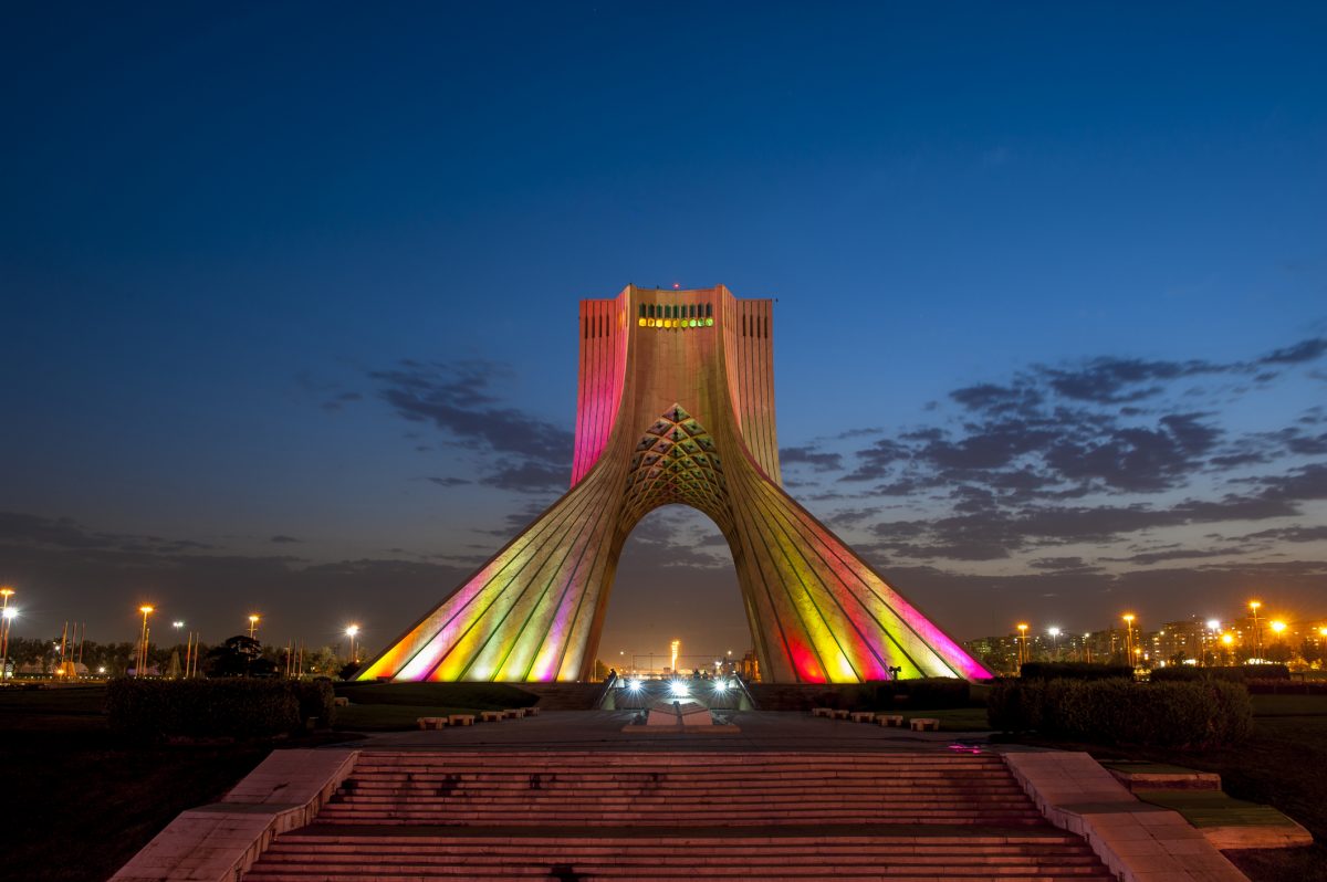 Photo of the Azadi Tower in Iran lit up at night